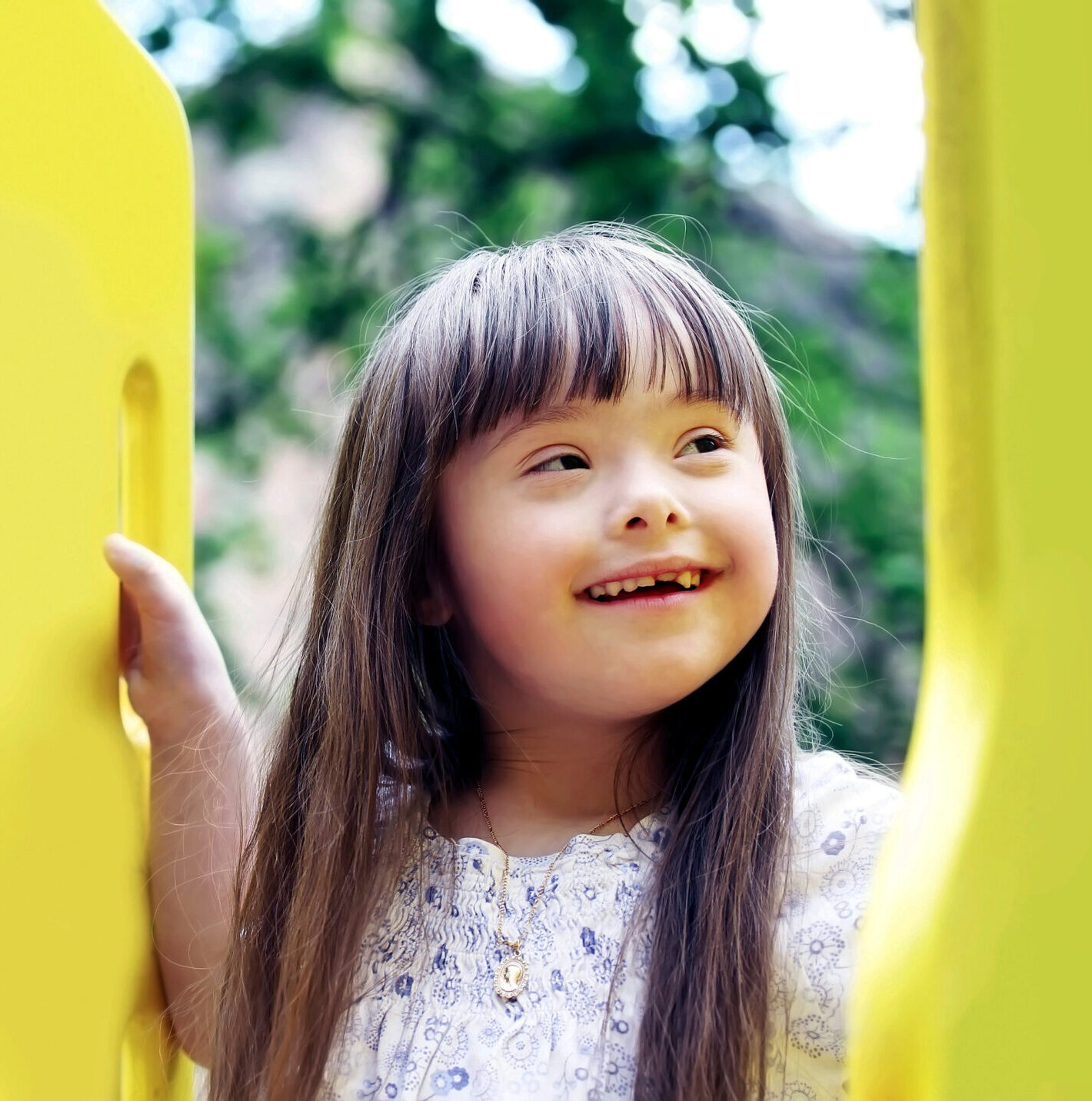 Portrait of beautiful young girl on the playground.