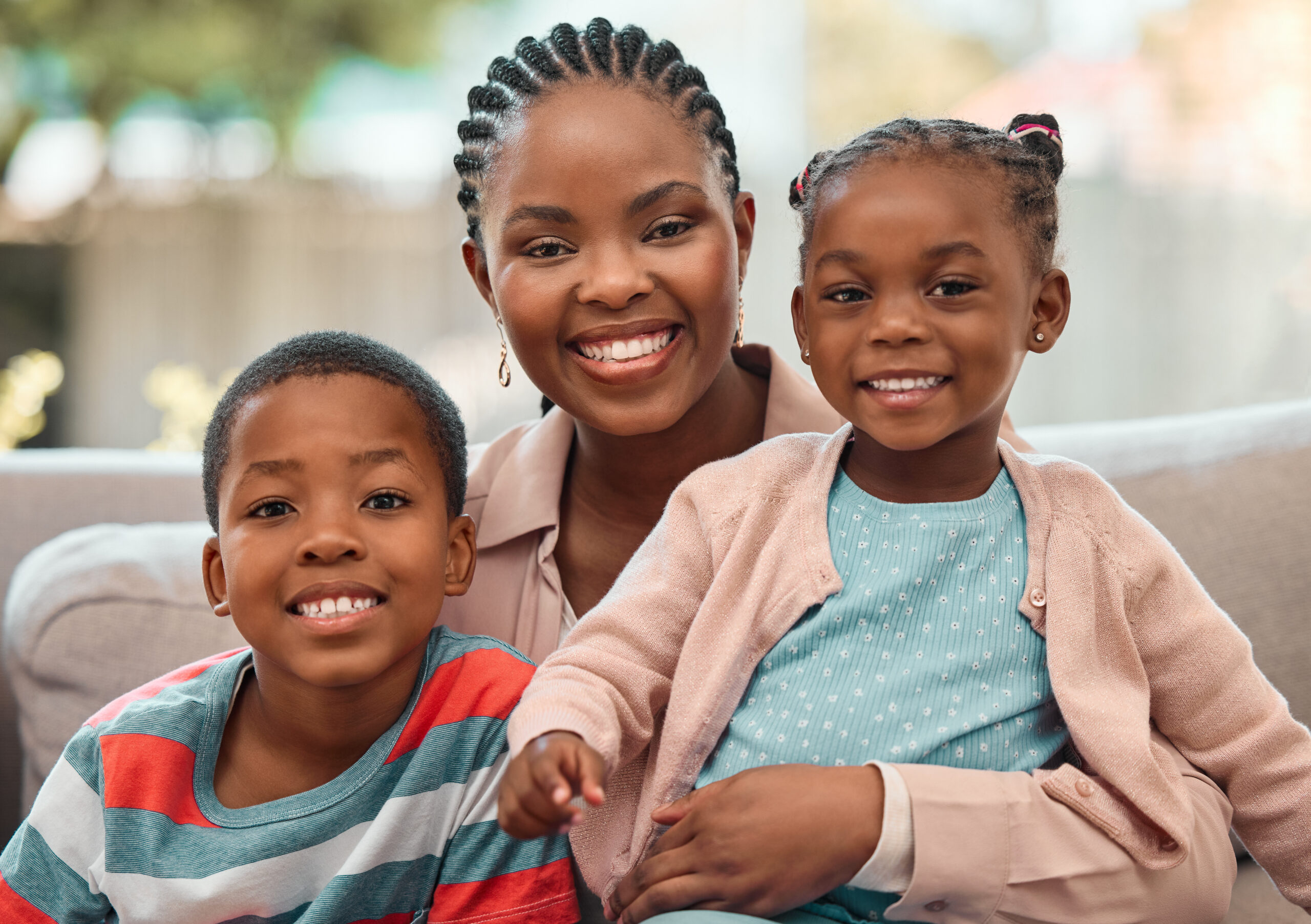 Portrait, happy black family and mother with kids on sofa at home for love, care or people relax. Smile, face or African children with mom for hug, trust or support with single parent or babysitter.